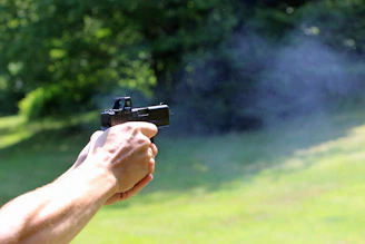 A person is shooting a gun.