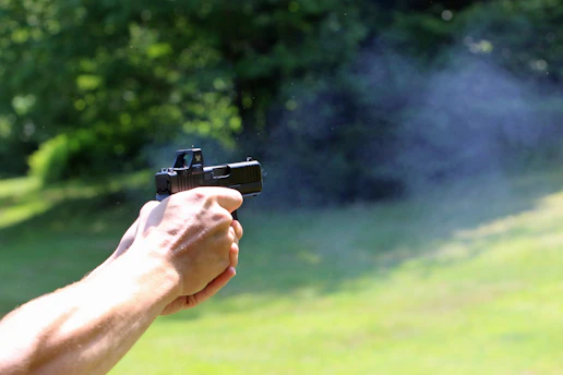 A person is shooting a gun.