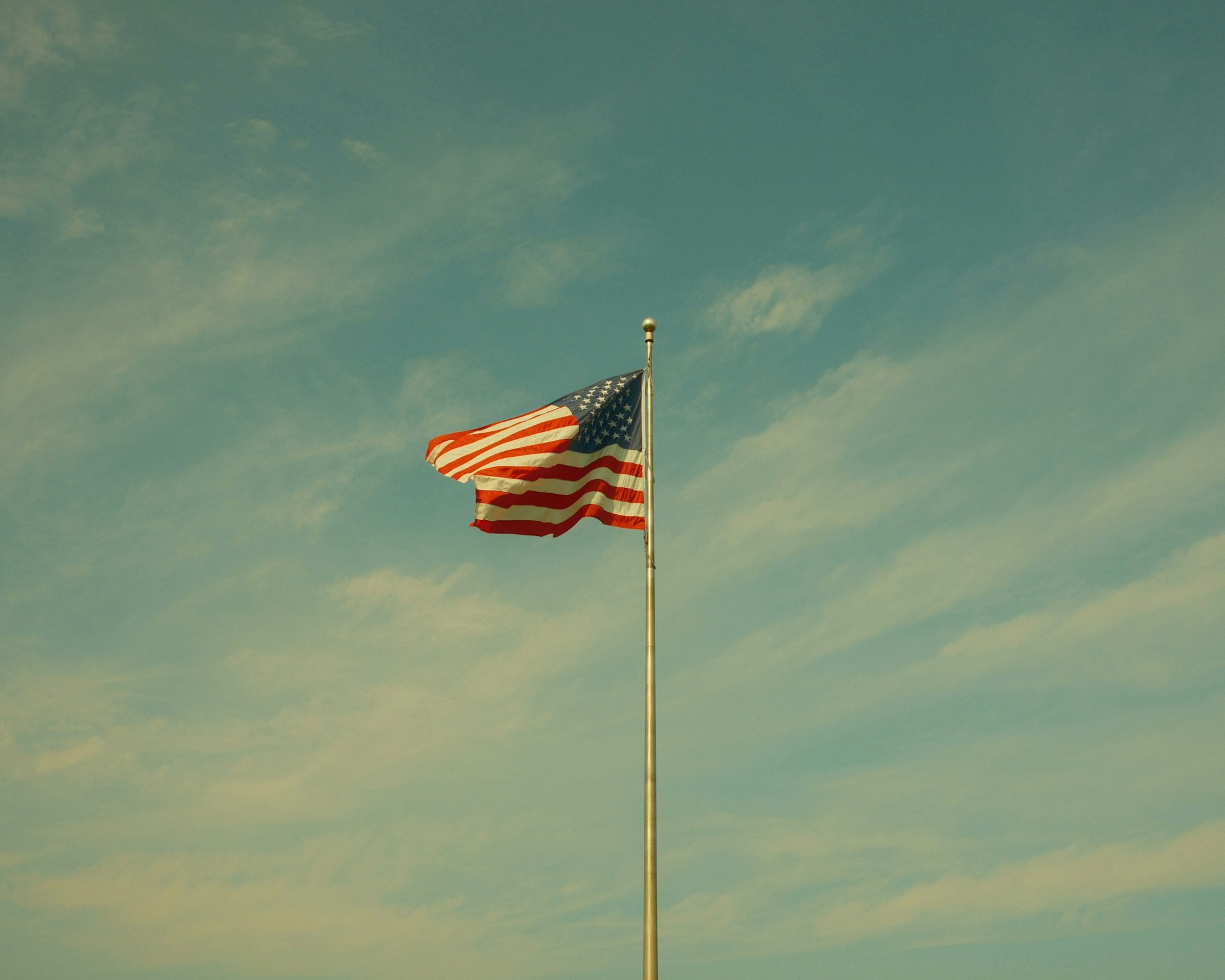 The american flag waves proudly in the sky.