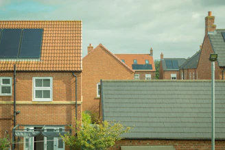 Houses with solar panels are shown in the image