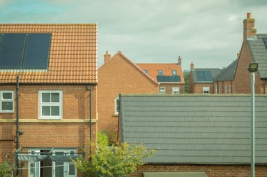 Houses with solar panels are shown in the image.
