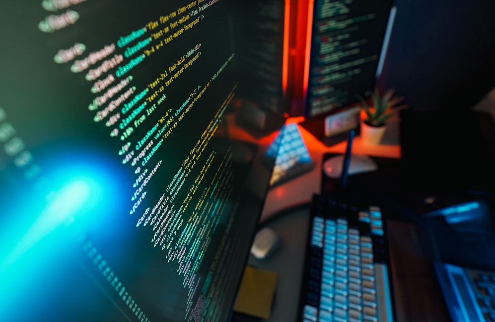 Website delivery code displayed across several screens in a dark workspace