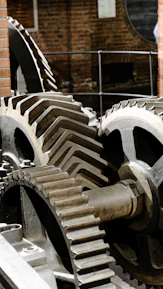 Gears interlocking, creating industrial motion.