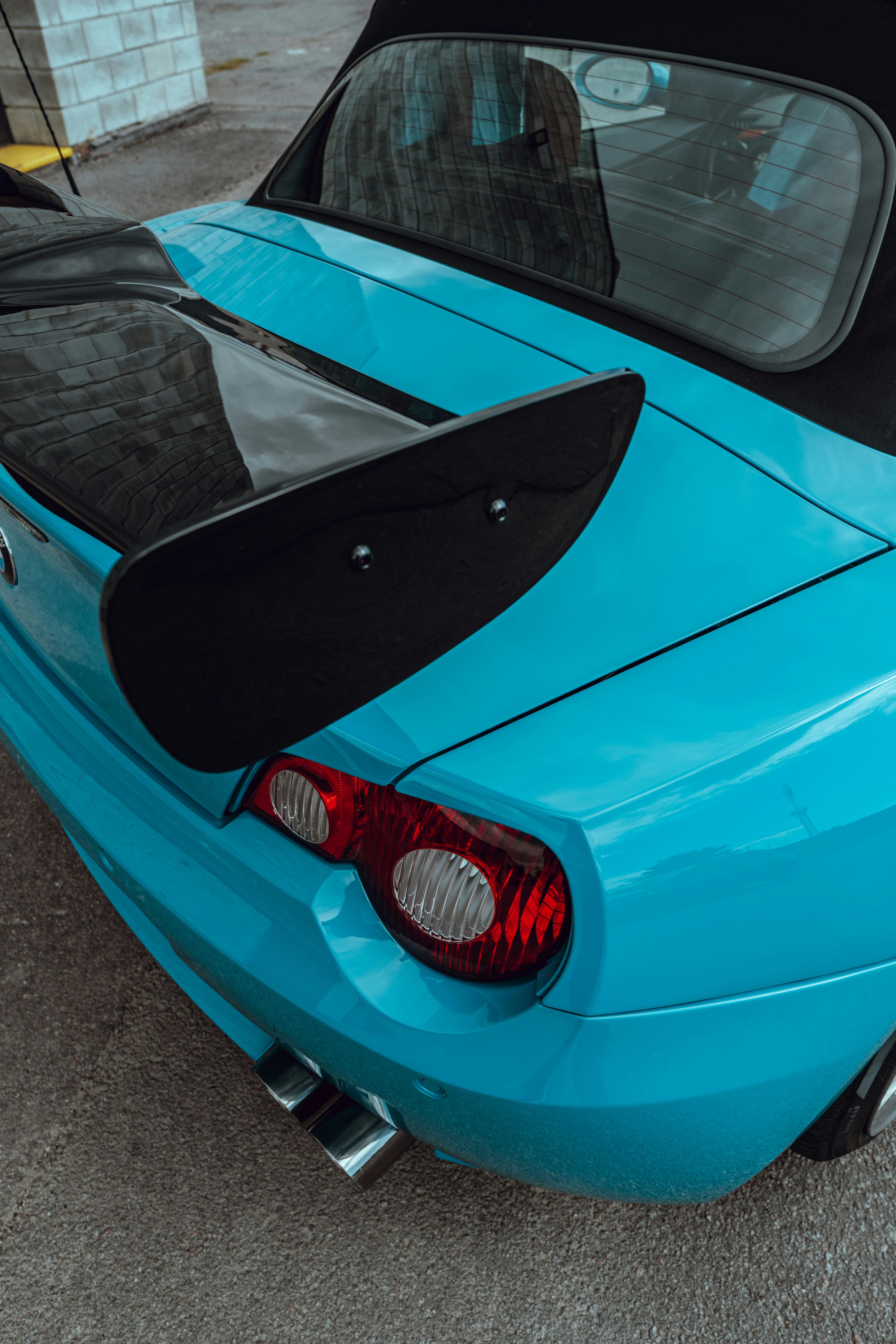 A bright blue car's back end.