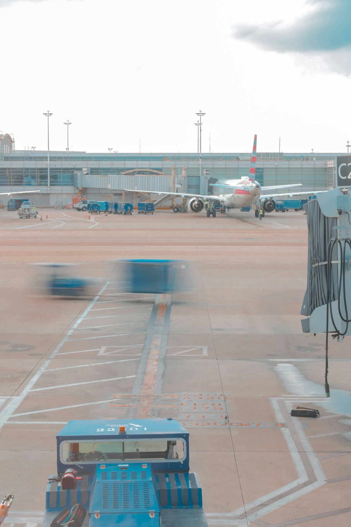Commercial airplane at airport gate ready for departure on a clear day