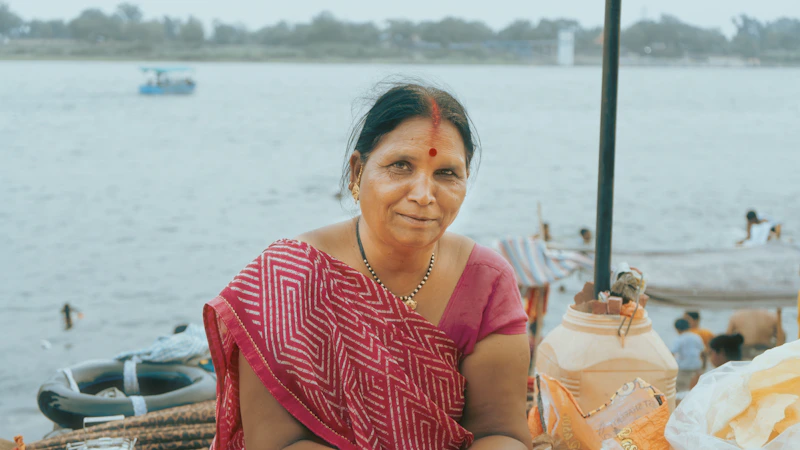 Peaceful Indian woman, potential sugar momma, by the water