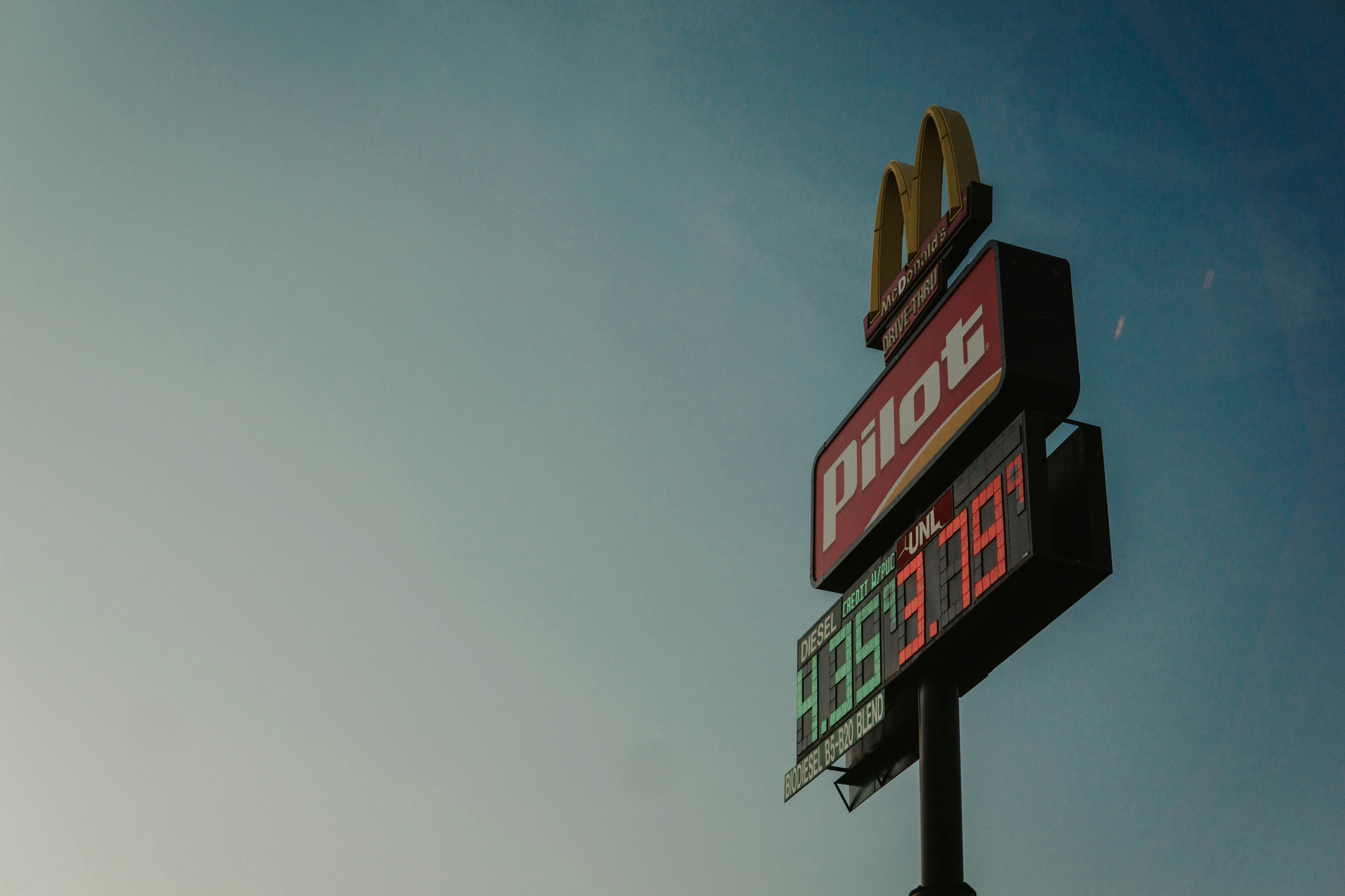 Mcdonald's and pilot gas station sign in the sky.