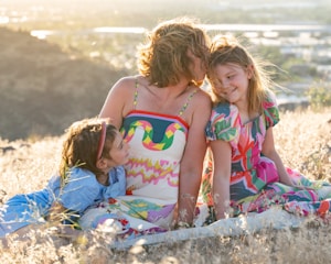 Mother and two daughters enjoying a sunny day outdoors
