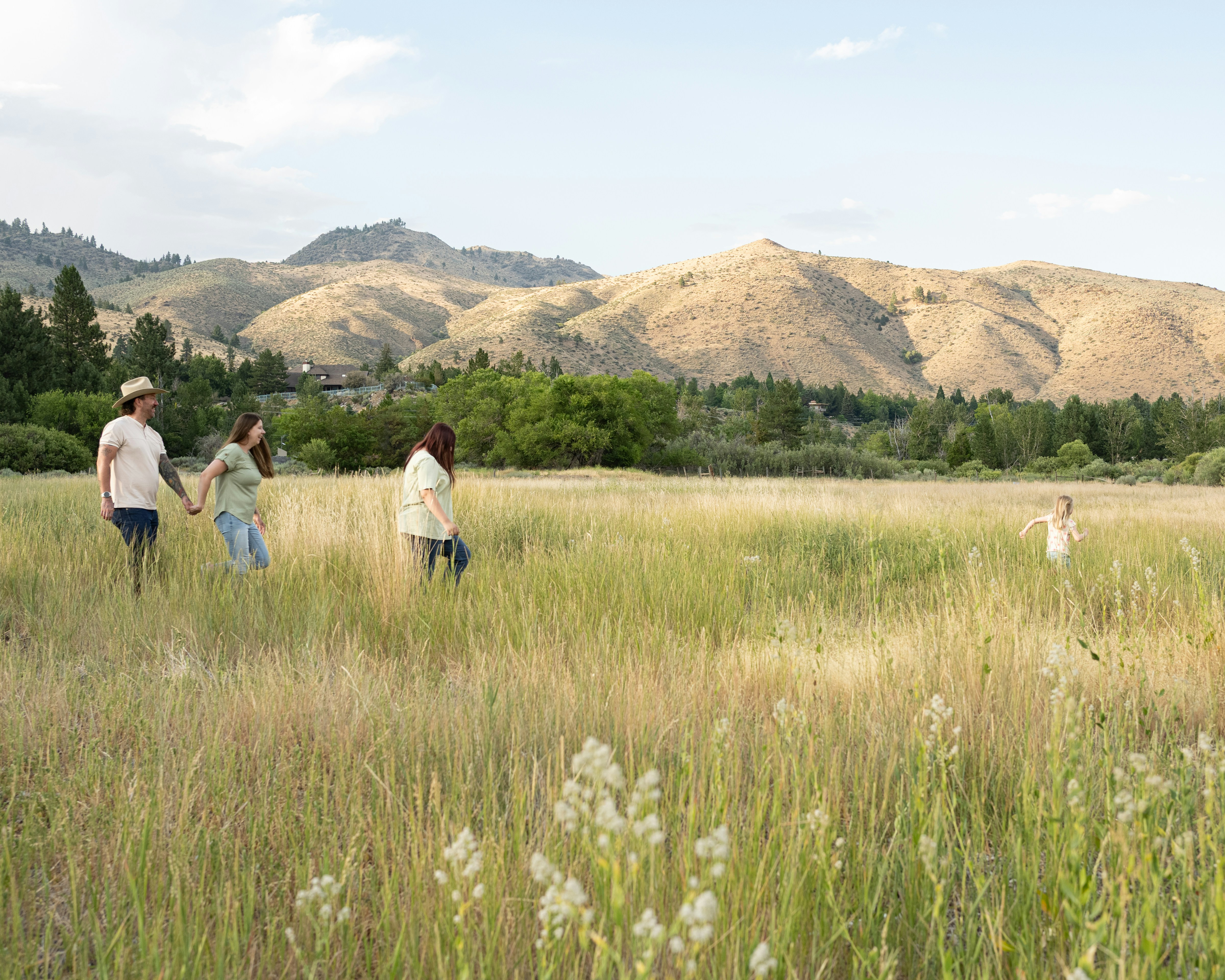 Family walking in field