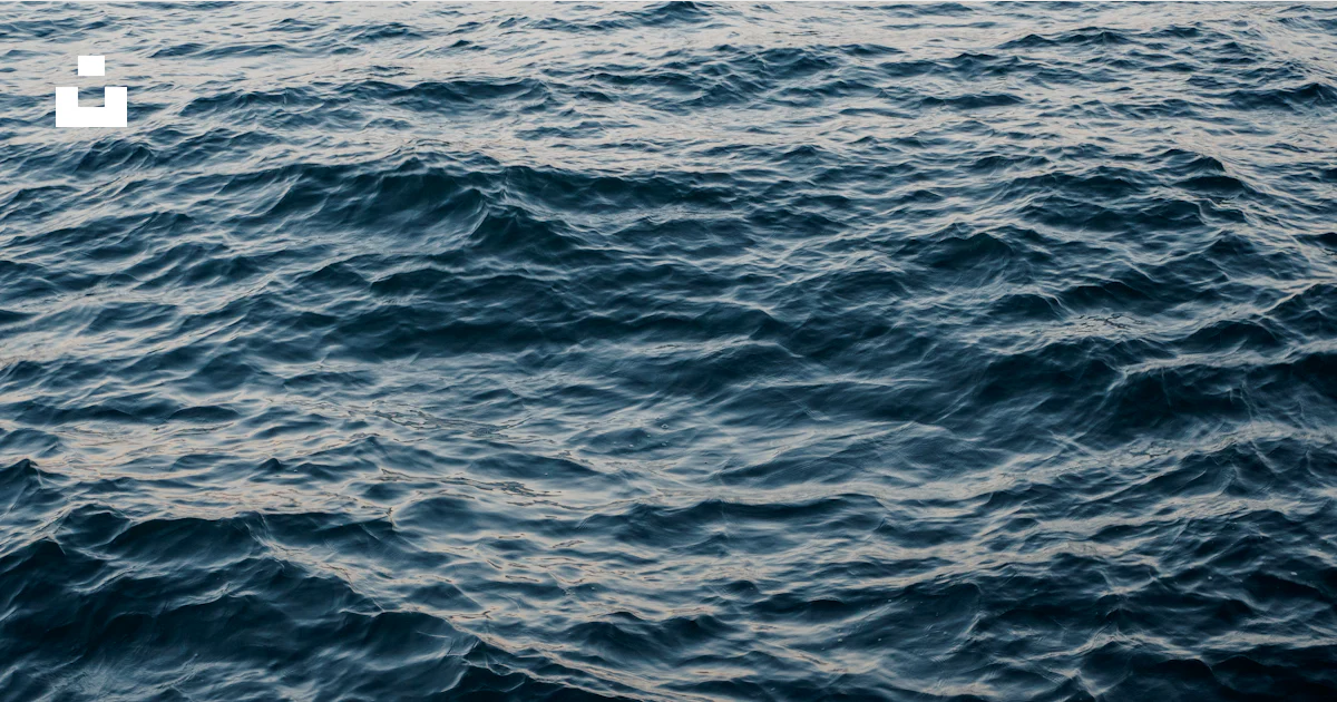 Wave Ripples On Mars Waves ripple across the dark ocean surface. photo – Free Sea Image on ...