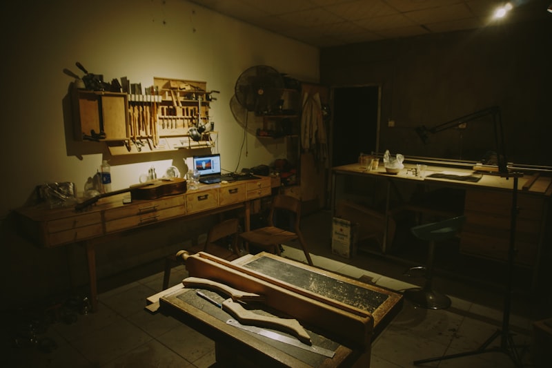 Dark workshop with tools and wood pieces
