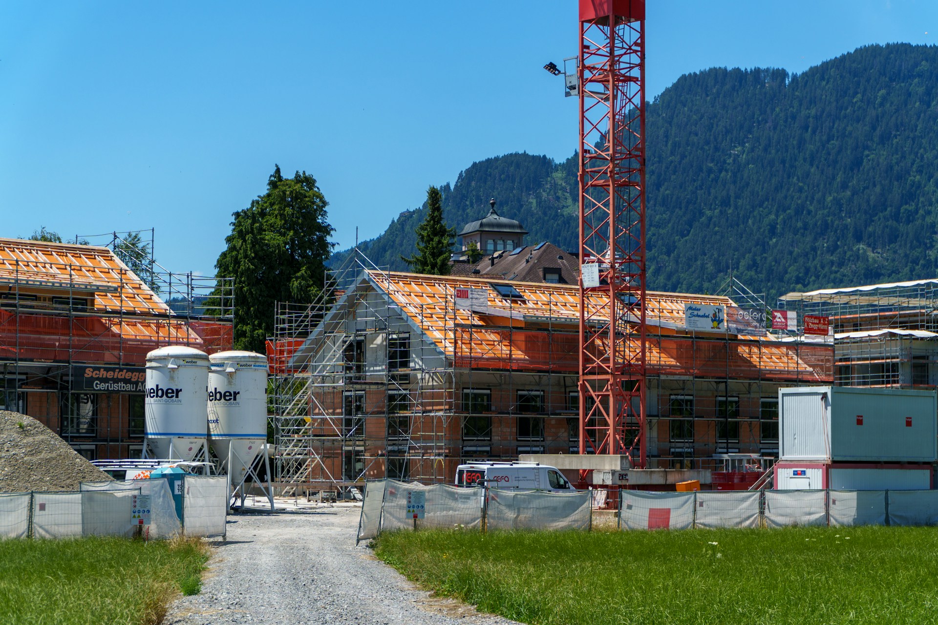 Construction of a building in a mountain landscape.
