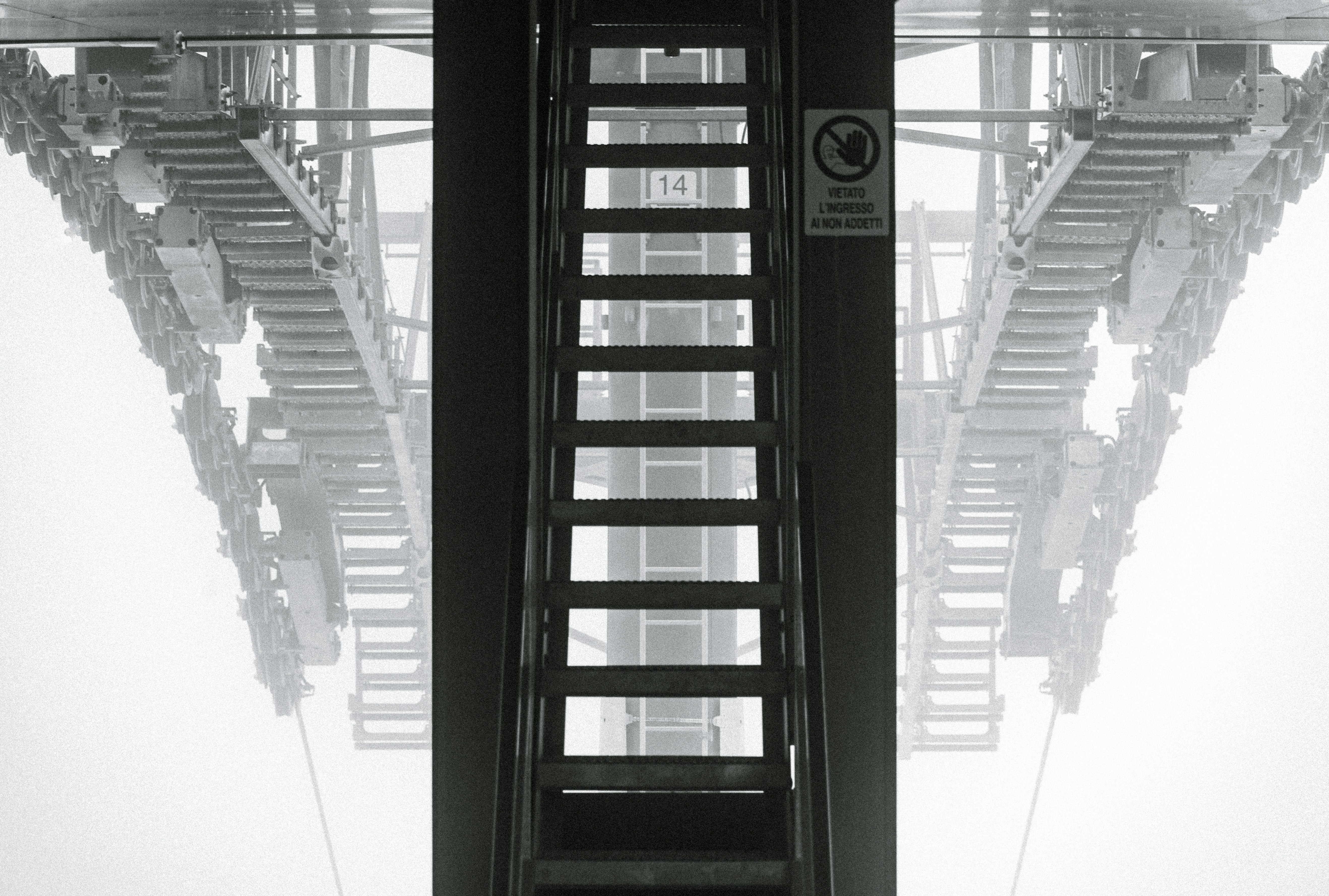 Stairs lead up, beneath a foggy structure.