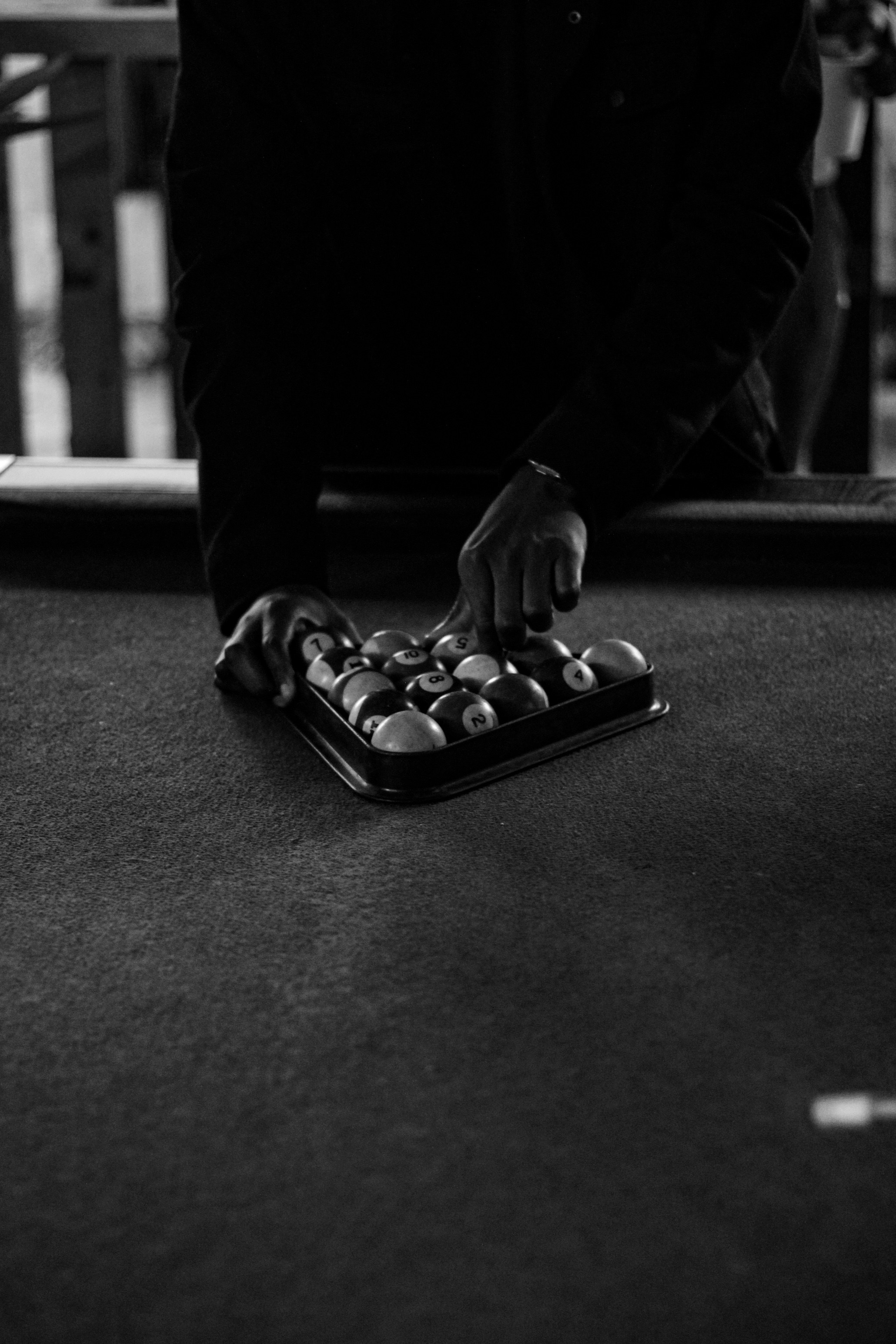 Preparing to break the pool balls.