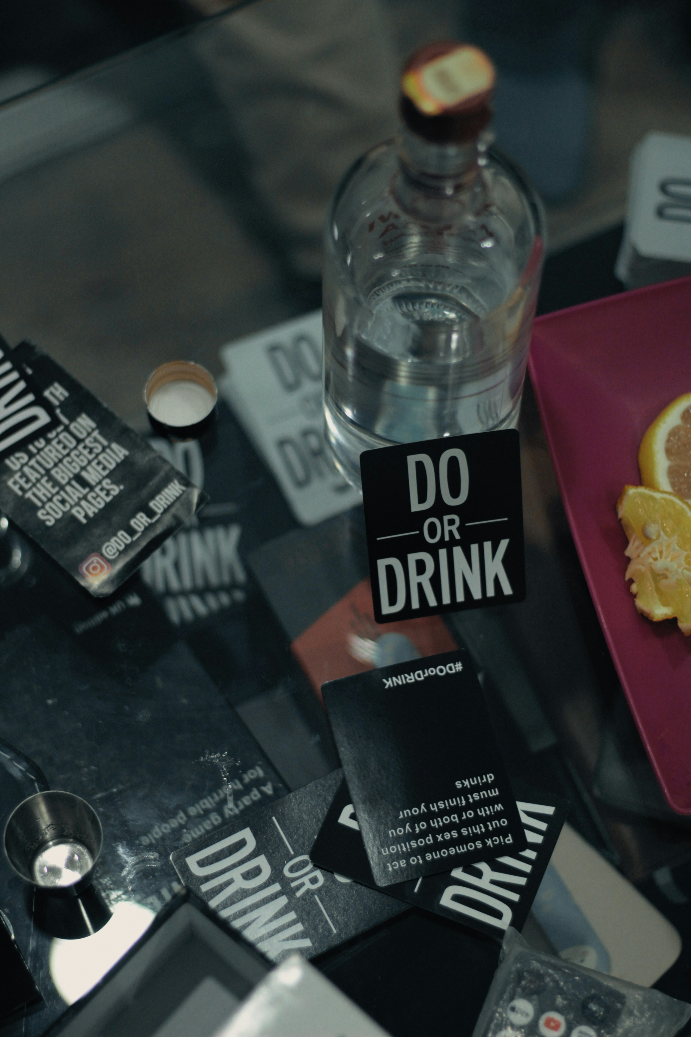A bottle of liquor and "do or drink" cards.
