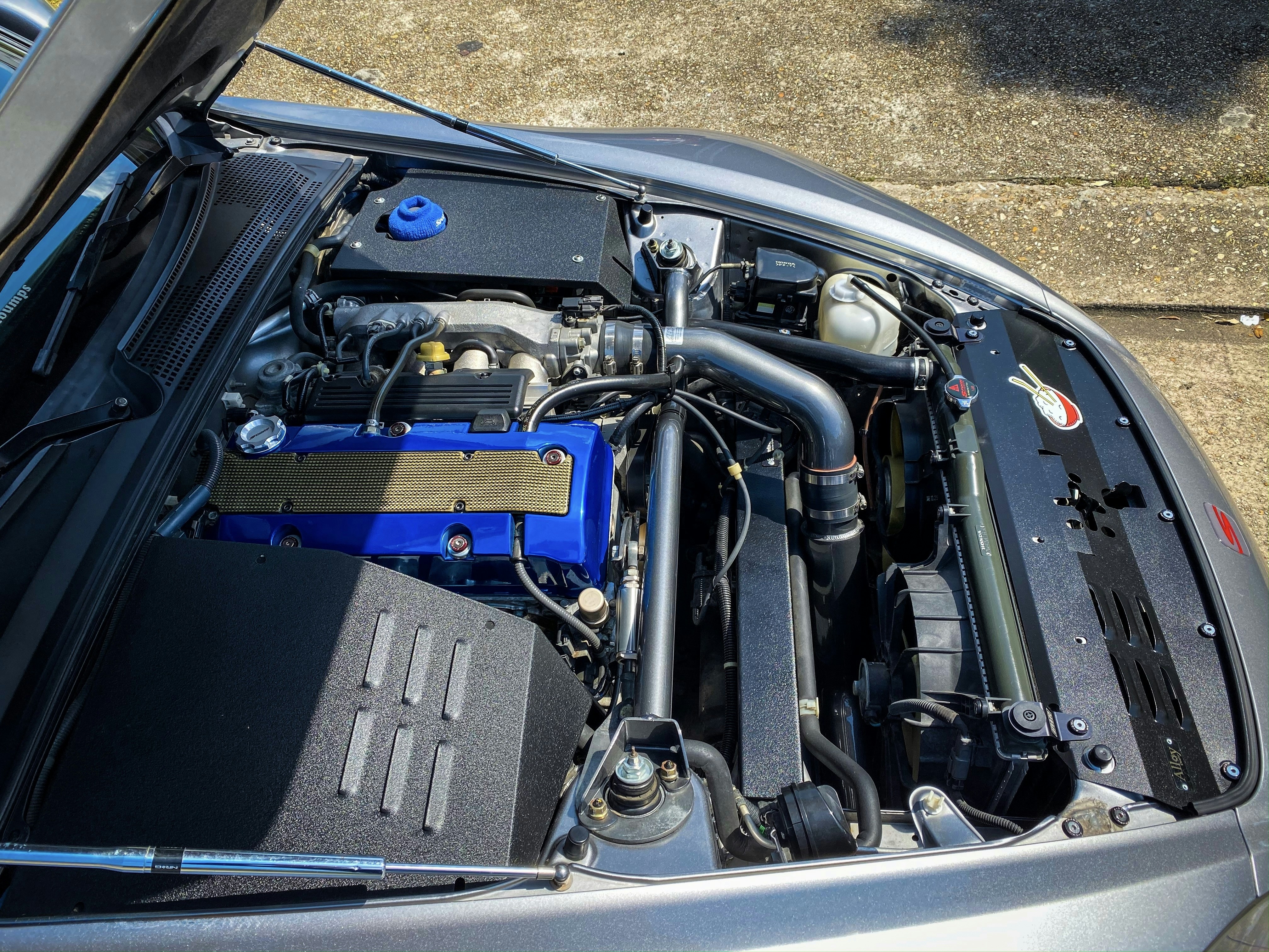 Close-up view of an electric vehicle battery pack and cooling lines