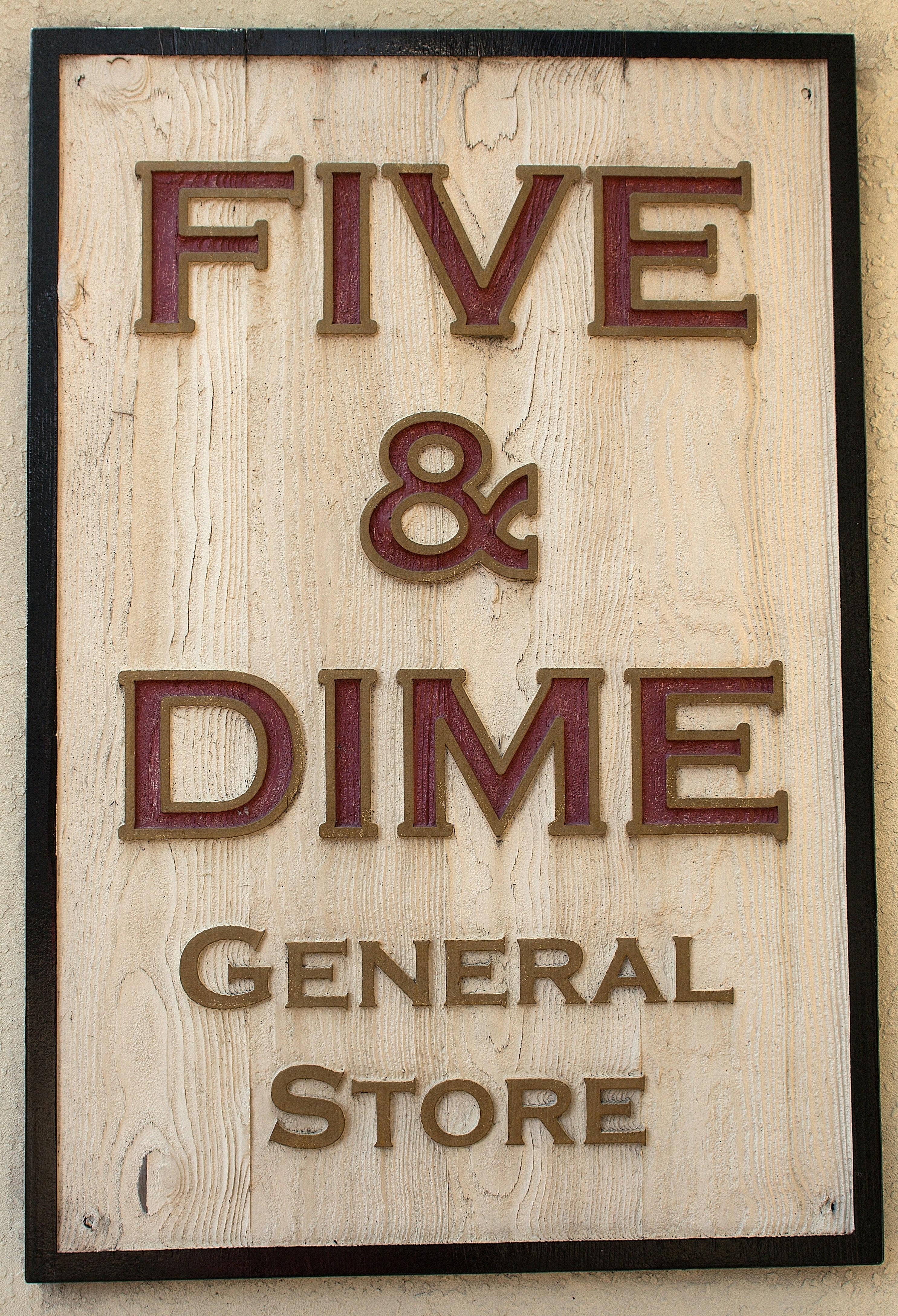 The image shows a "five & dime" general store sign.