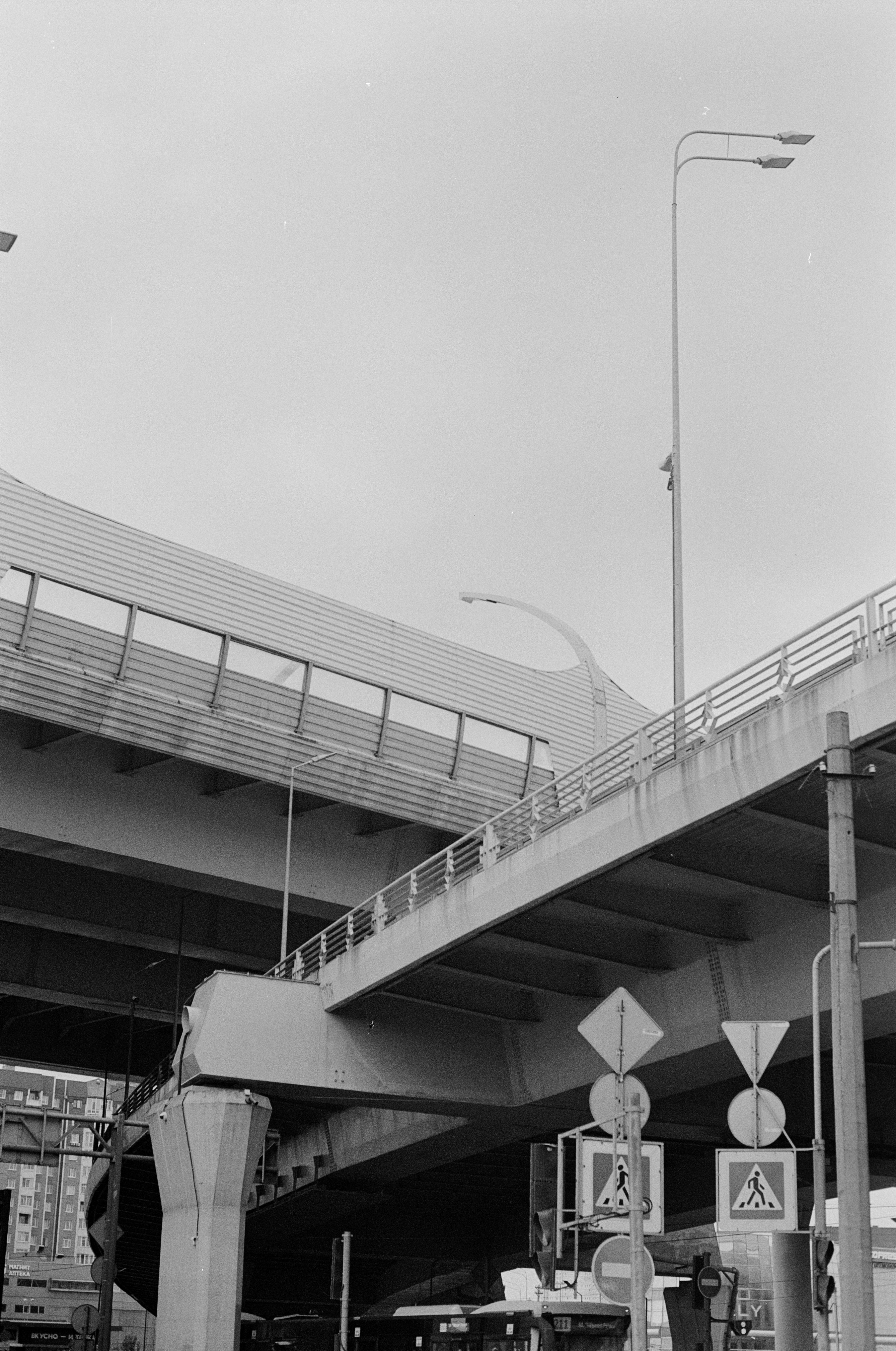 Overpass and signs on a cloudy day.