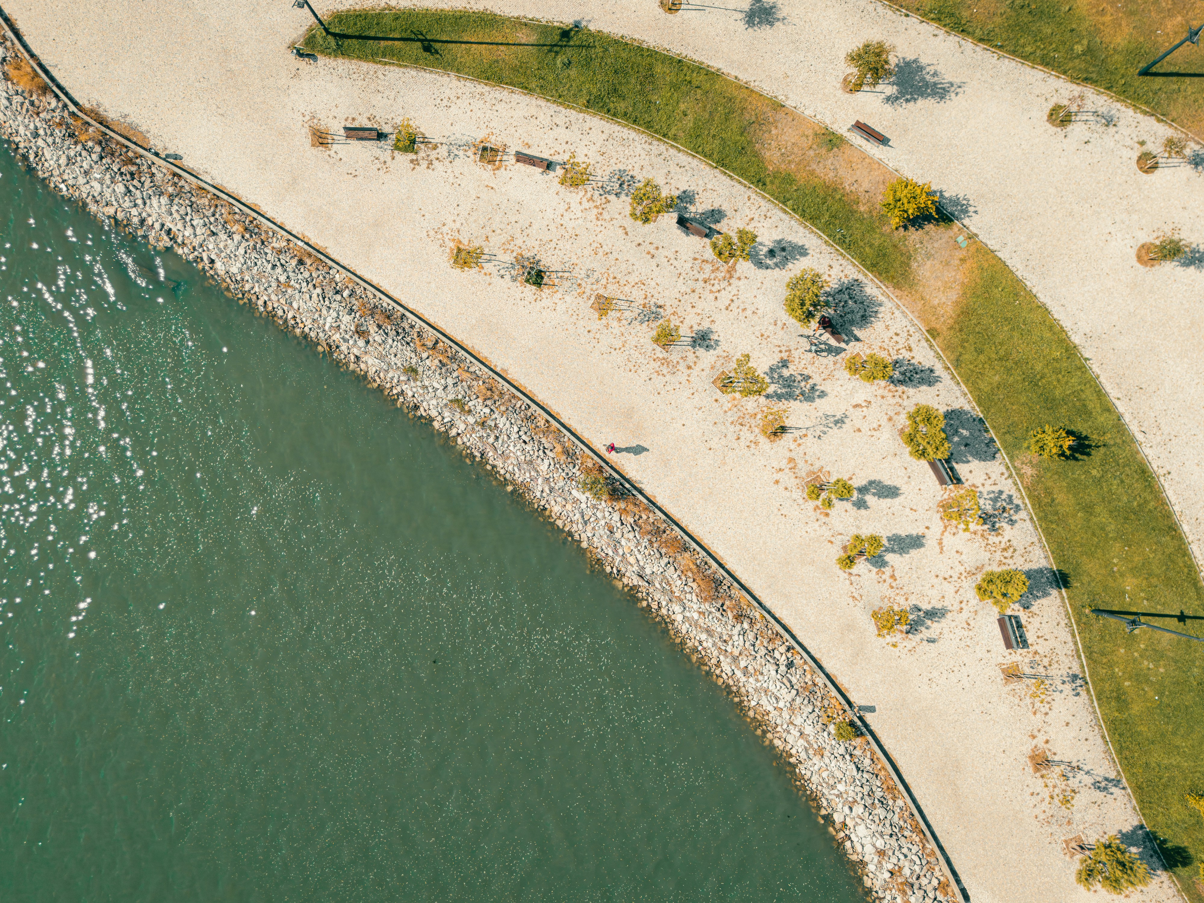 Aerial view of a waterfront park and water.