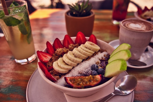 Healthy breakfast bowl with other refreshments is ready.