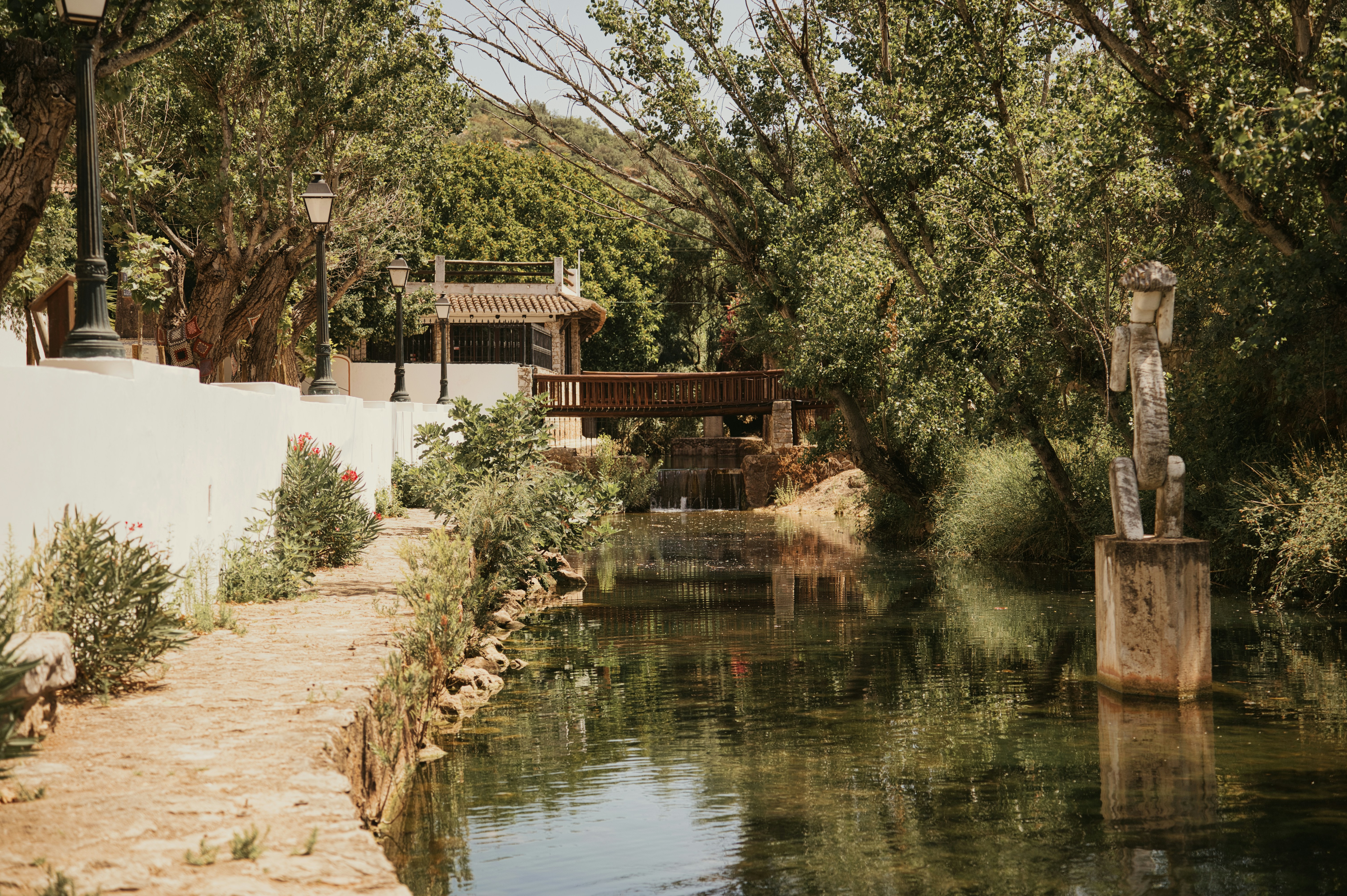 A picturesque river flows through lush green scenery.
