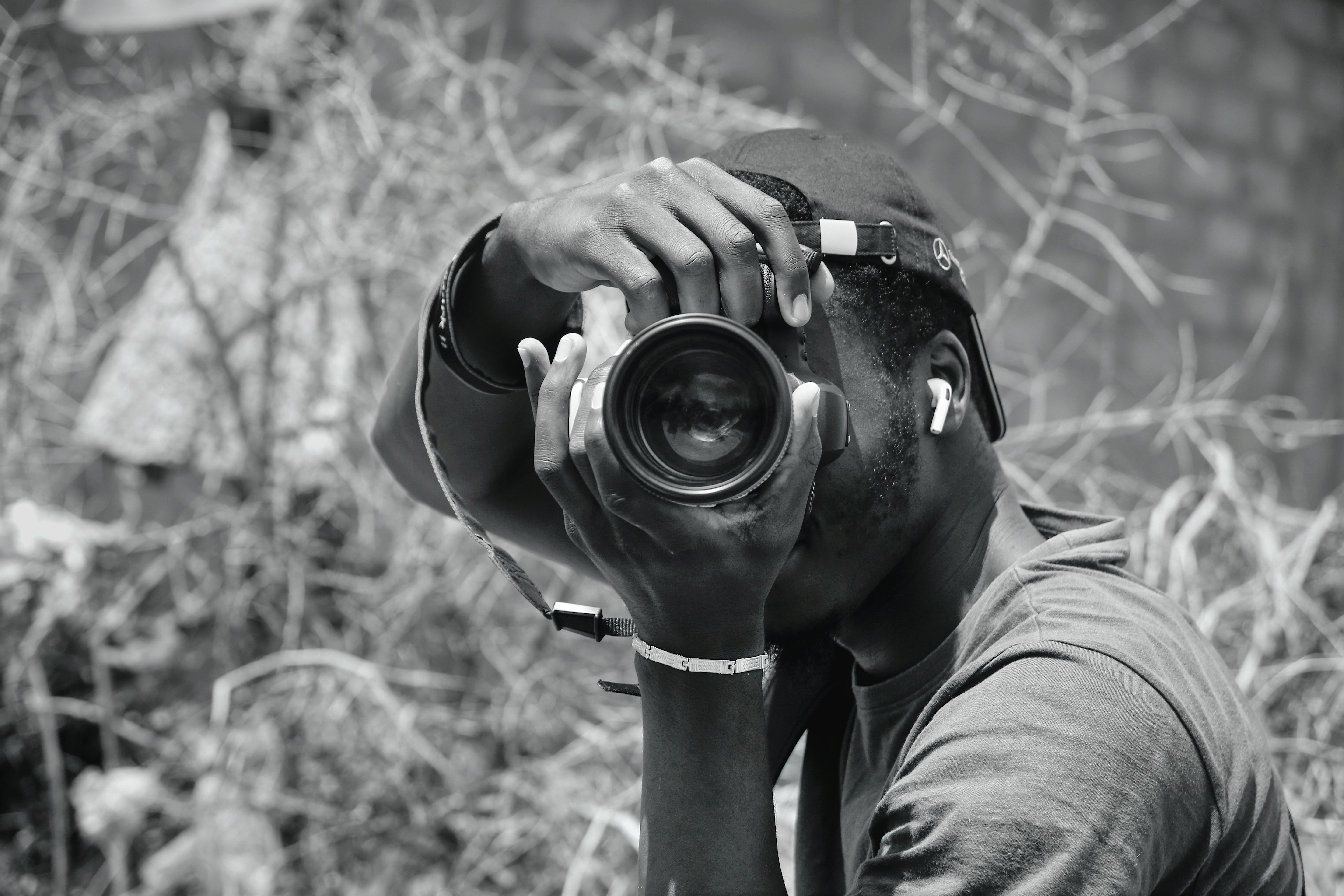 Photographer focused on his camera for a shot.