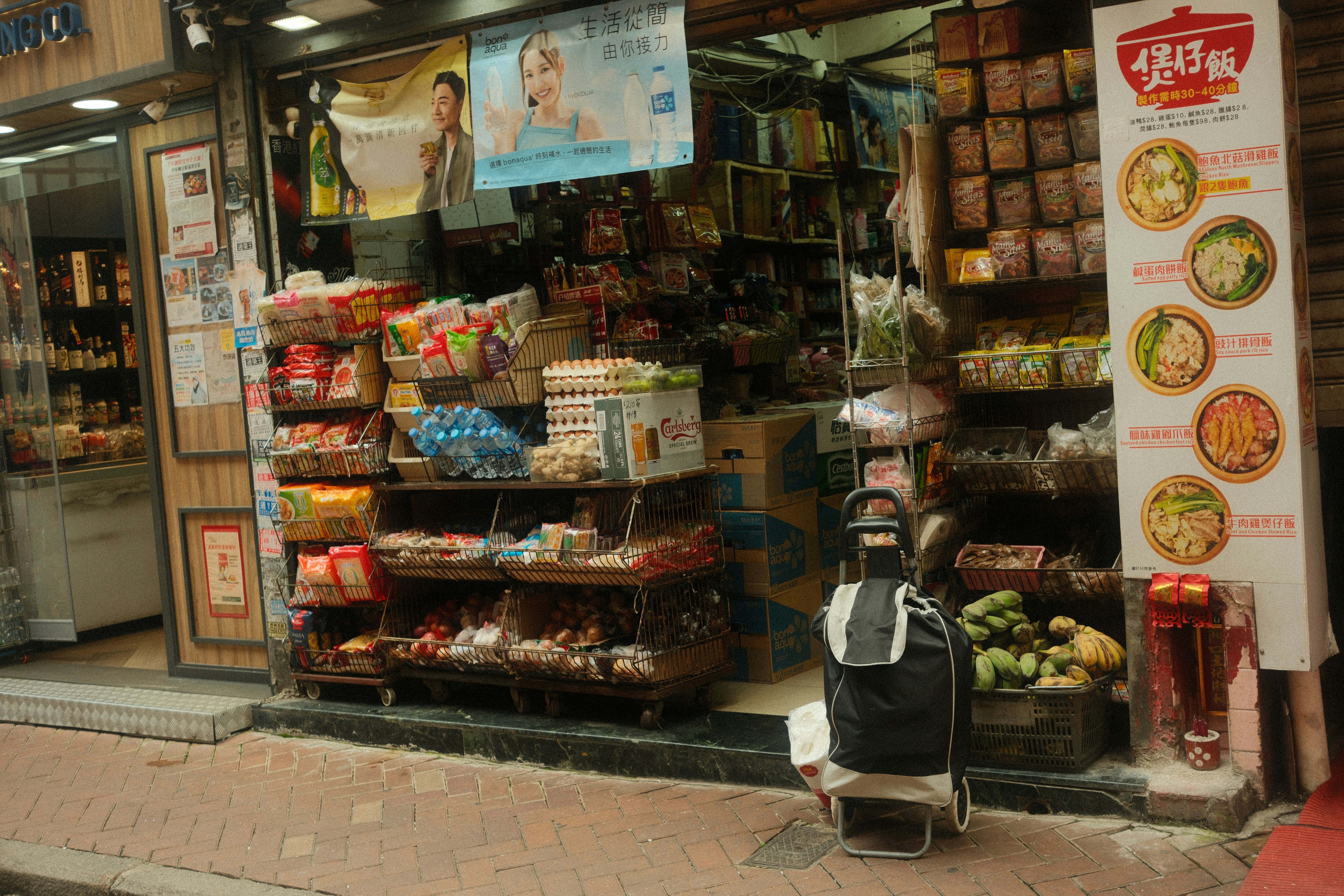 A cluttered store entrance displaying various goods.