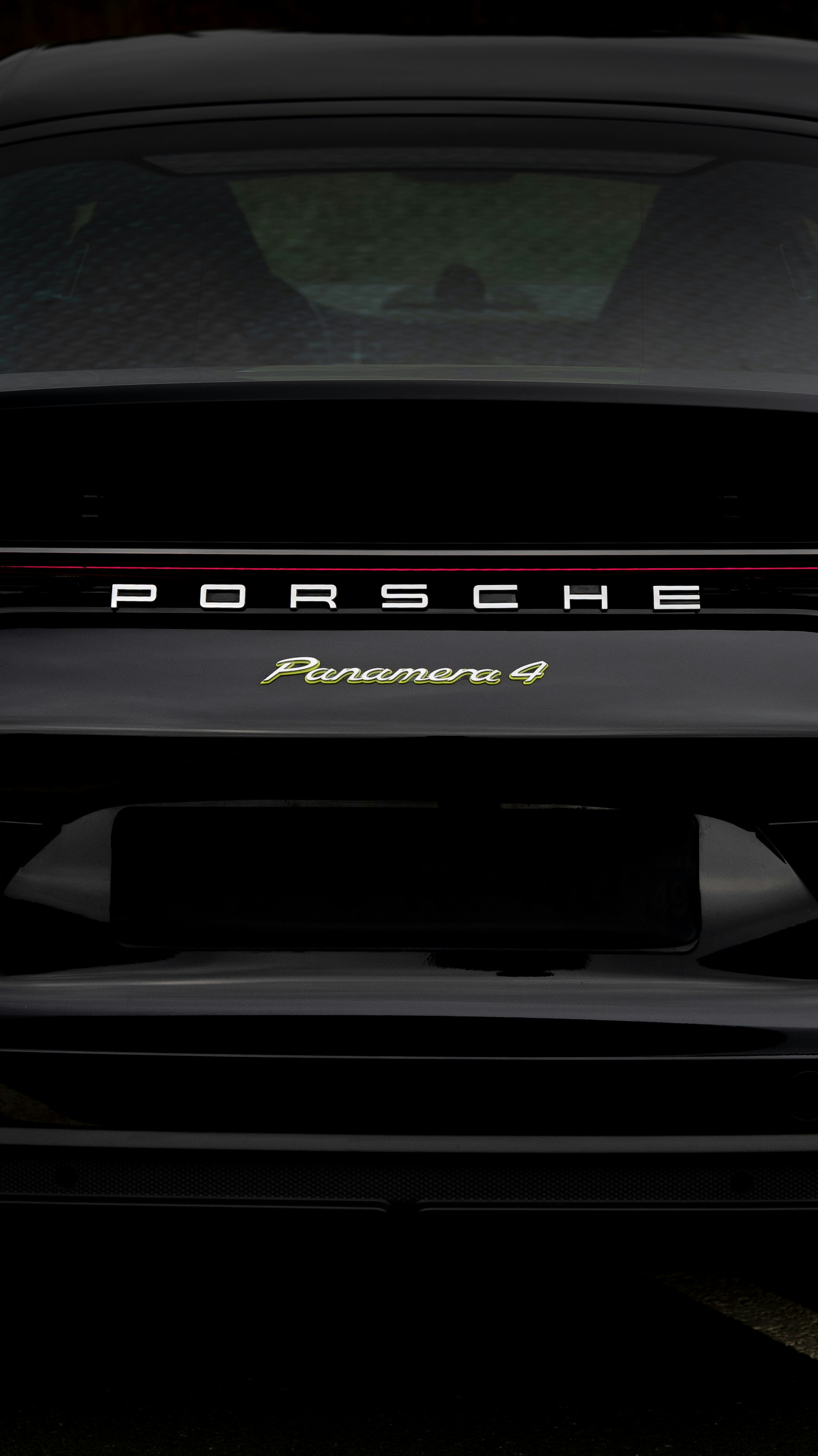 A black porsche panamera 4.