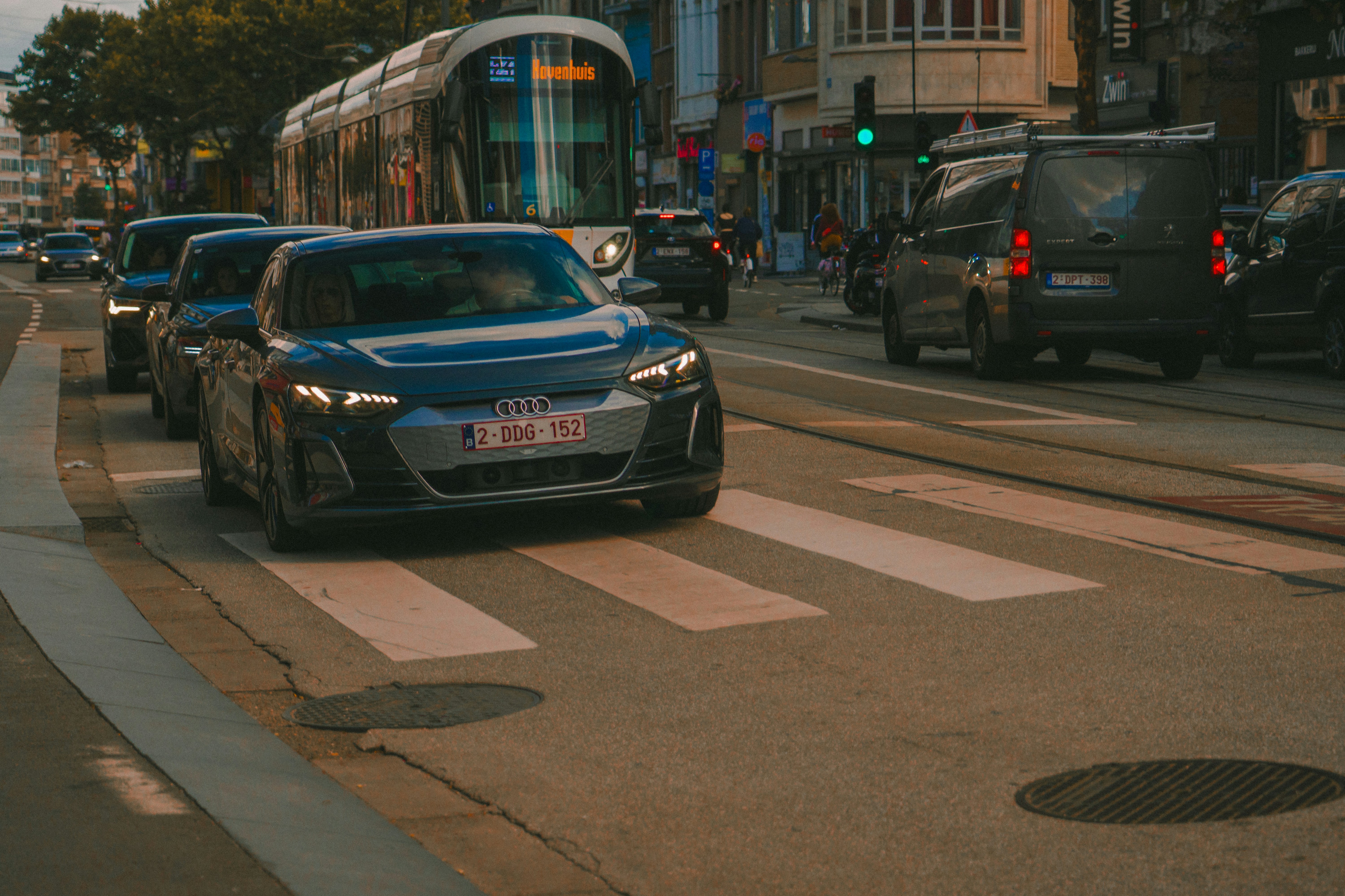 Compact hybrid SUV driving in an urban environment