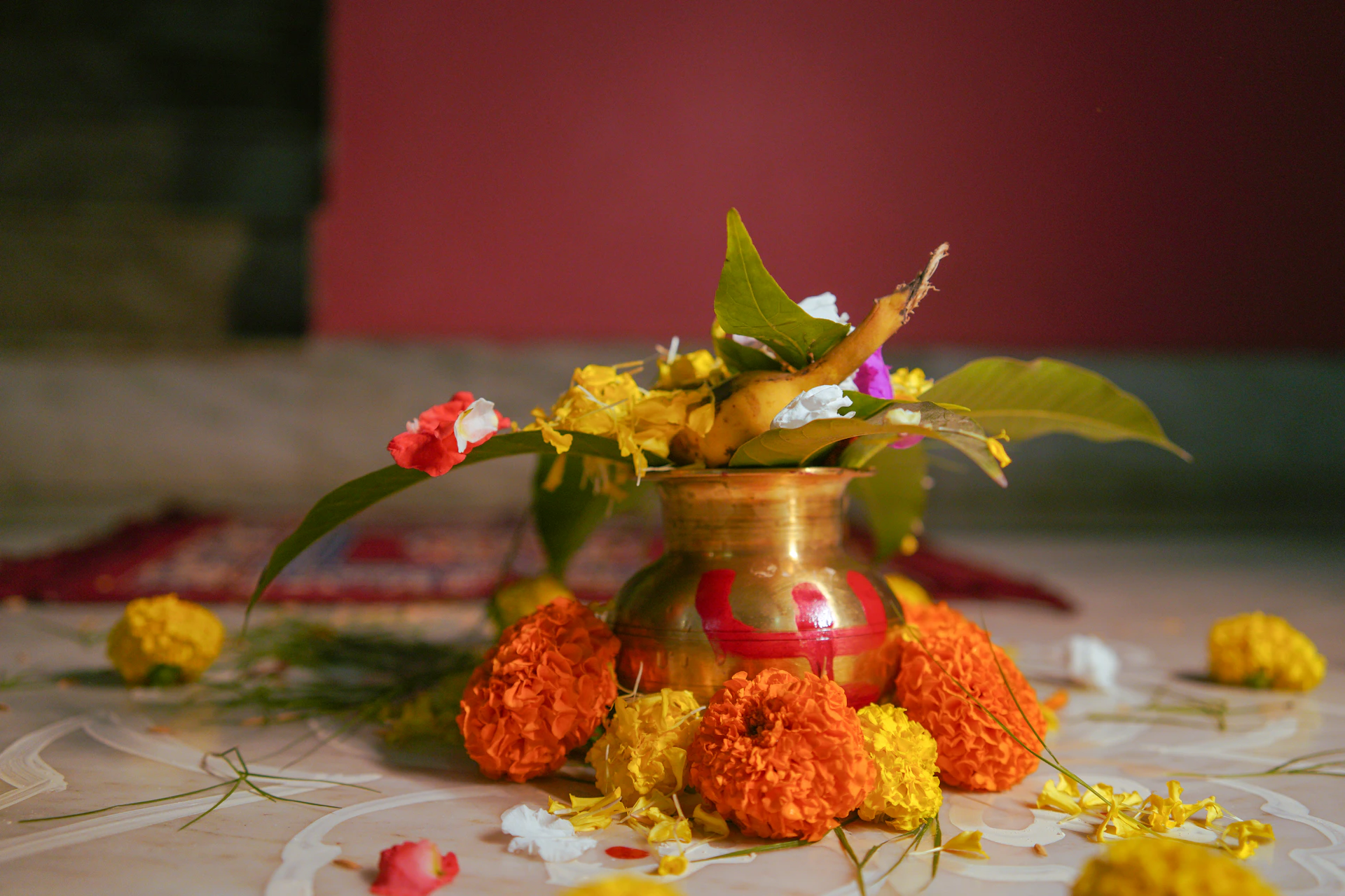 An indian religious pot with flowers and leaves