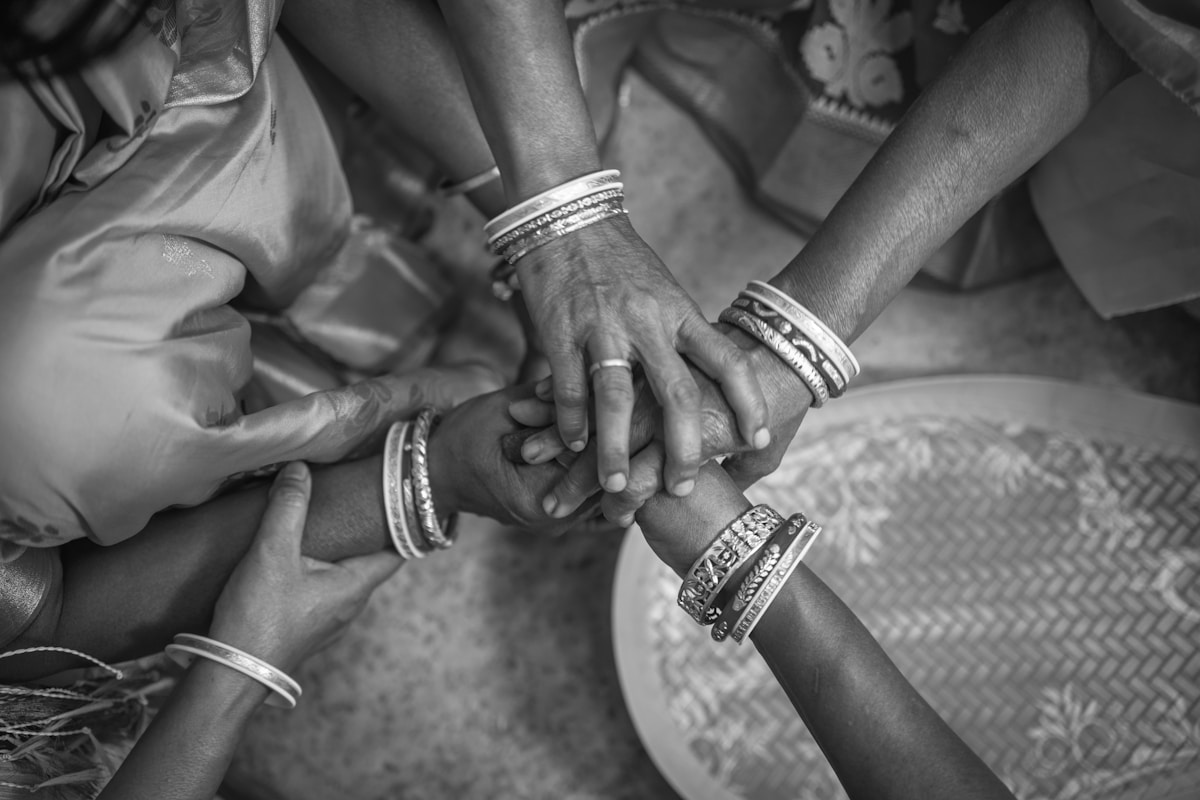 Hands stacked together symbolizing unity