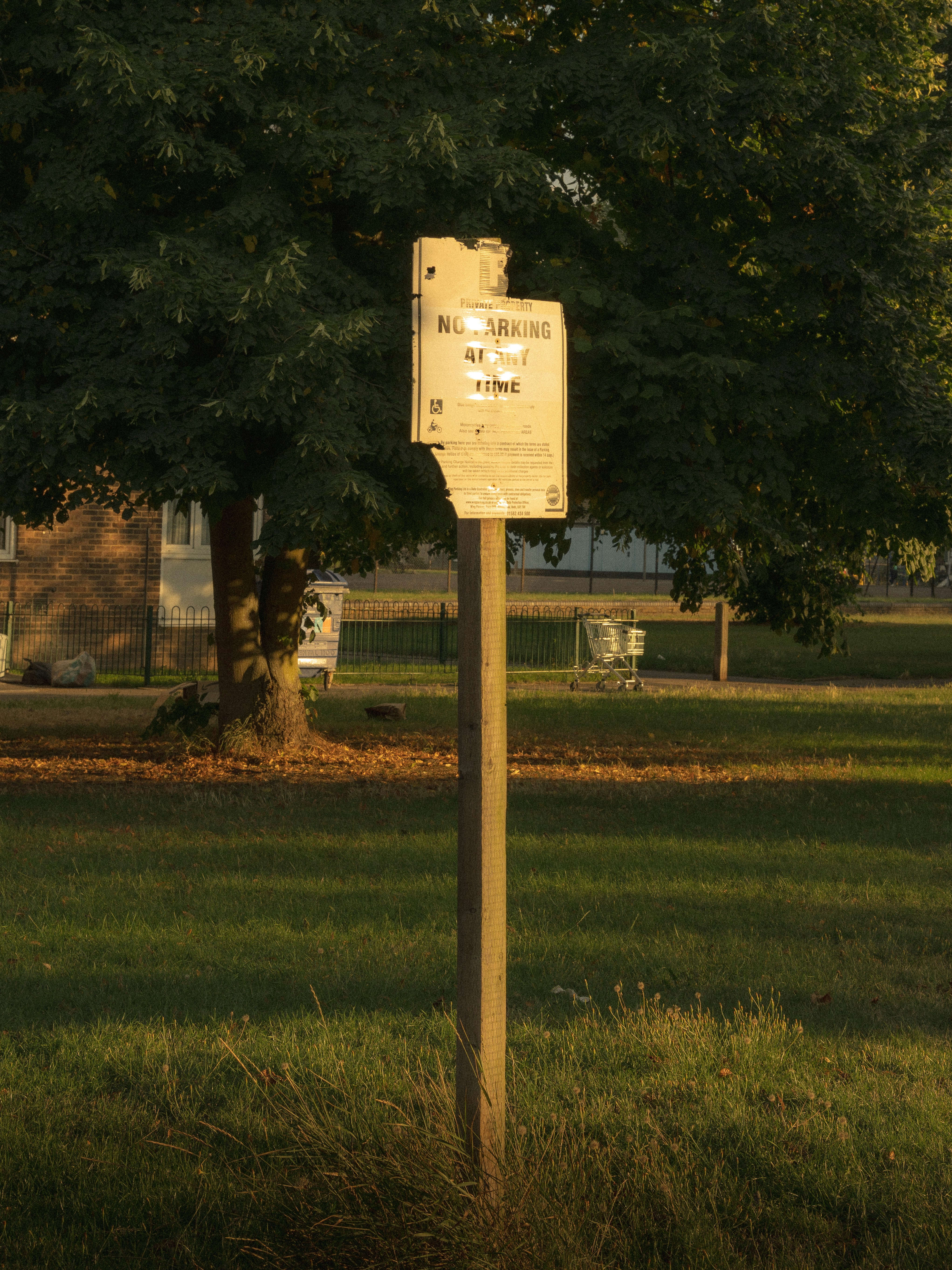Weathered "No Parking" sign.