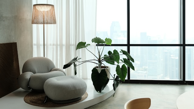 Cozy and minimalist living room with city view.