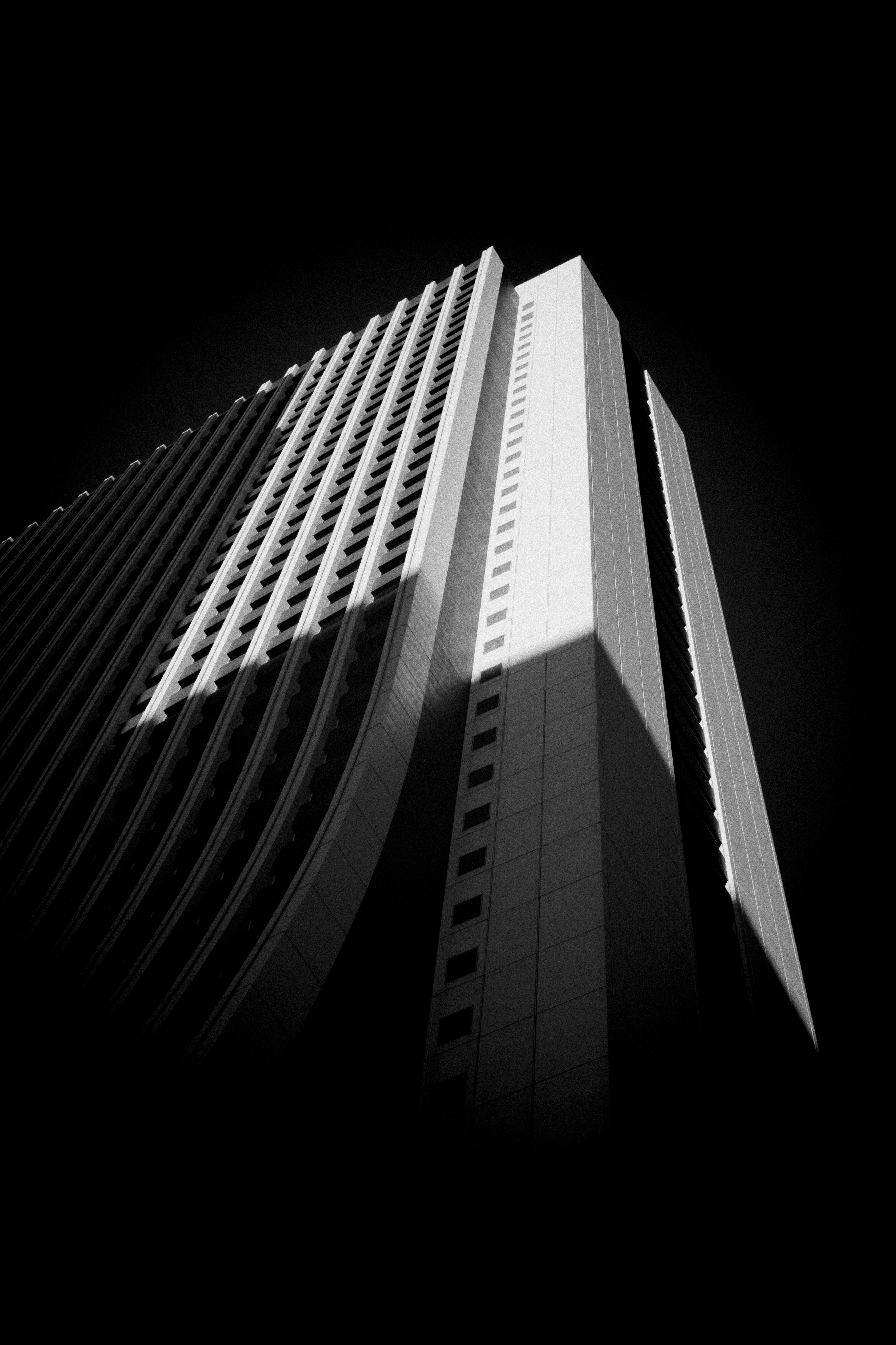 A black and white photo of a tall building.