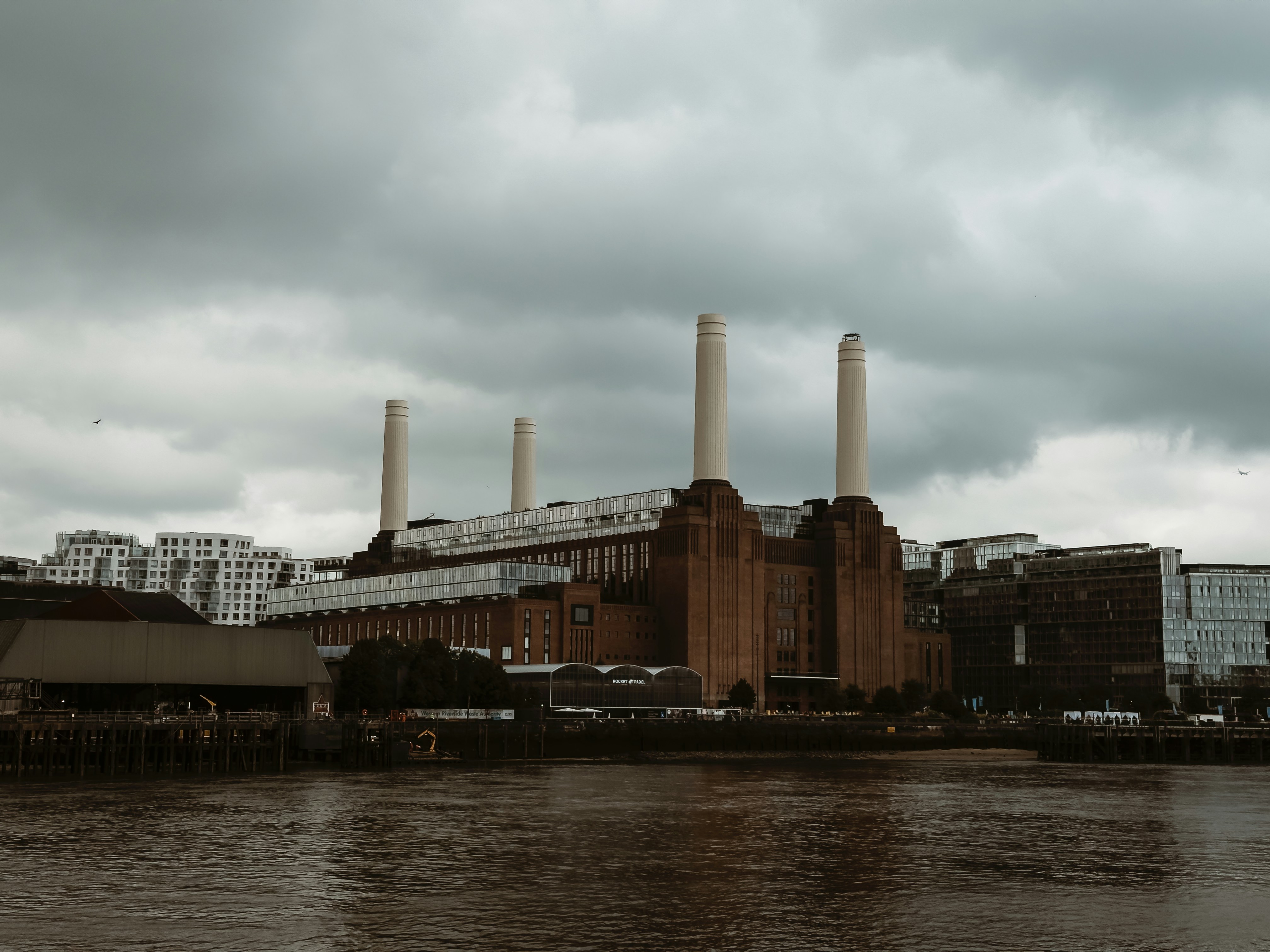 Battersea power station sits beneath a cloudy sky.
