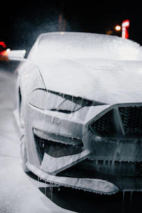A car gets washed with foam.