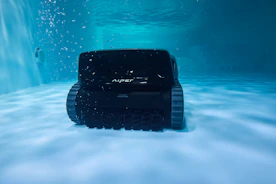 A pool robot cleaning the bottom underwater.