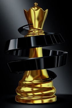 A golden queen chess piece with black swirl.