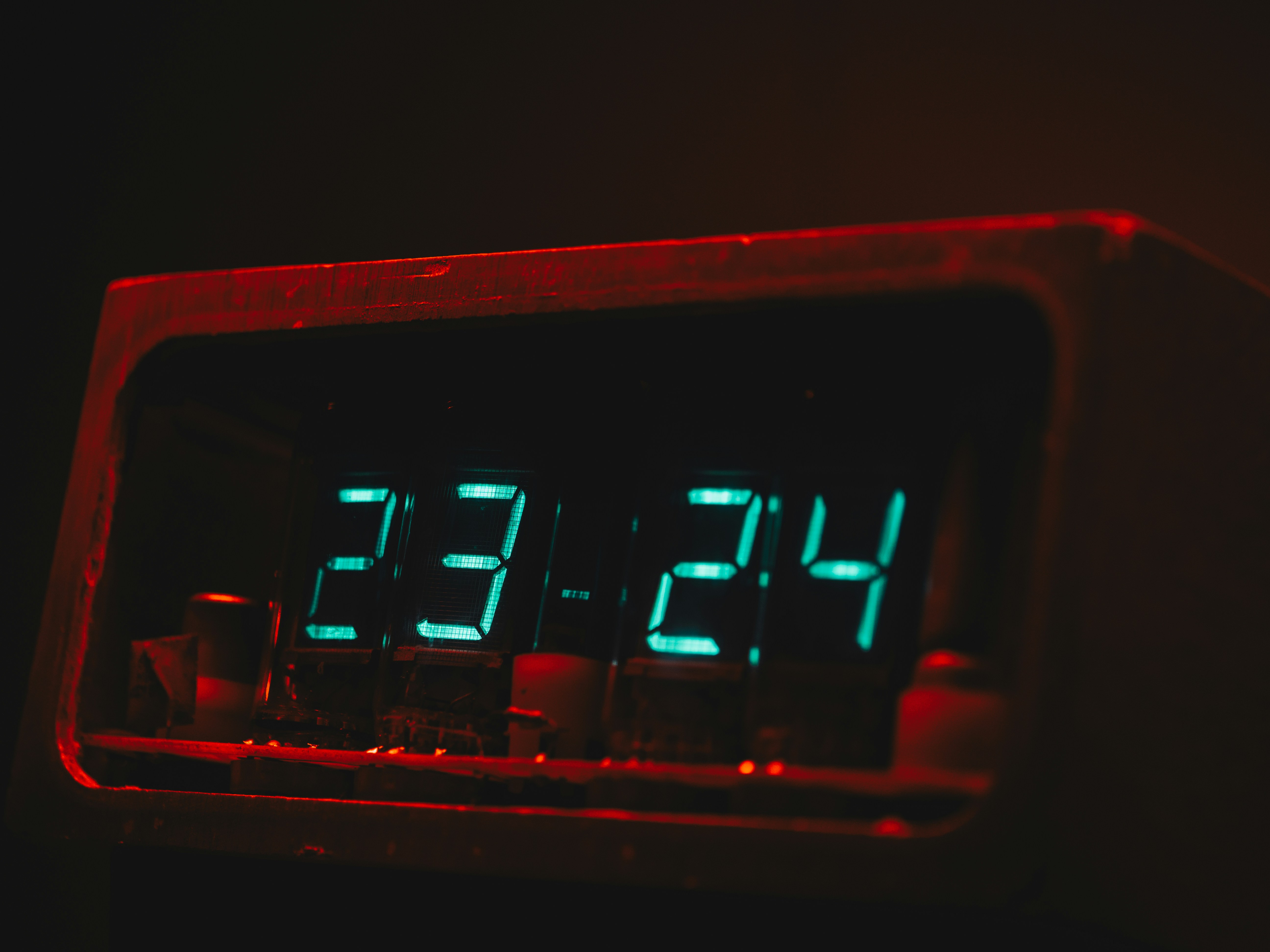 The illuminated clock shows 23:24.