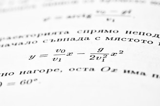 A mathematical formula is shown on an open book.