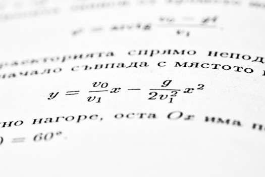 A mathematical formula is shown on an open book.