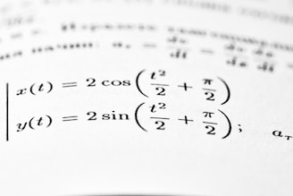 Mathematical equations are shown on a printed page.