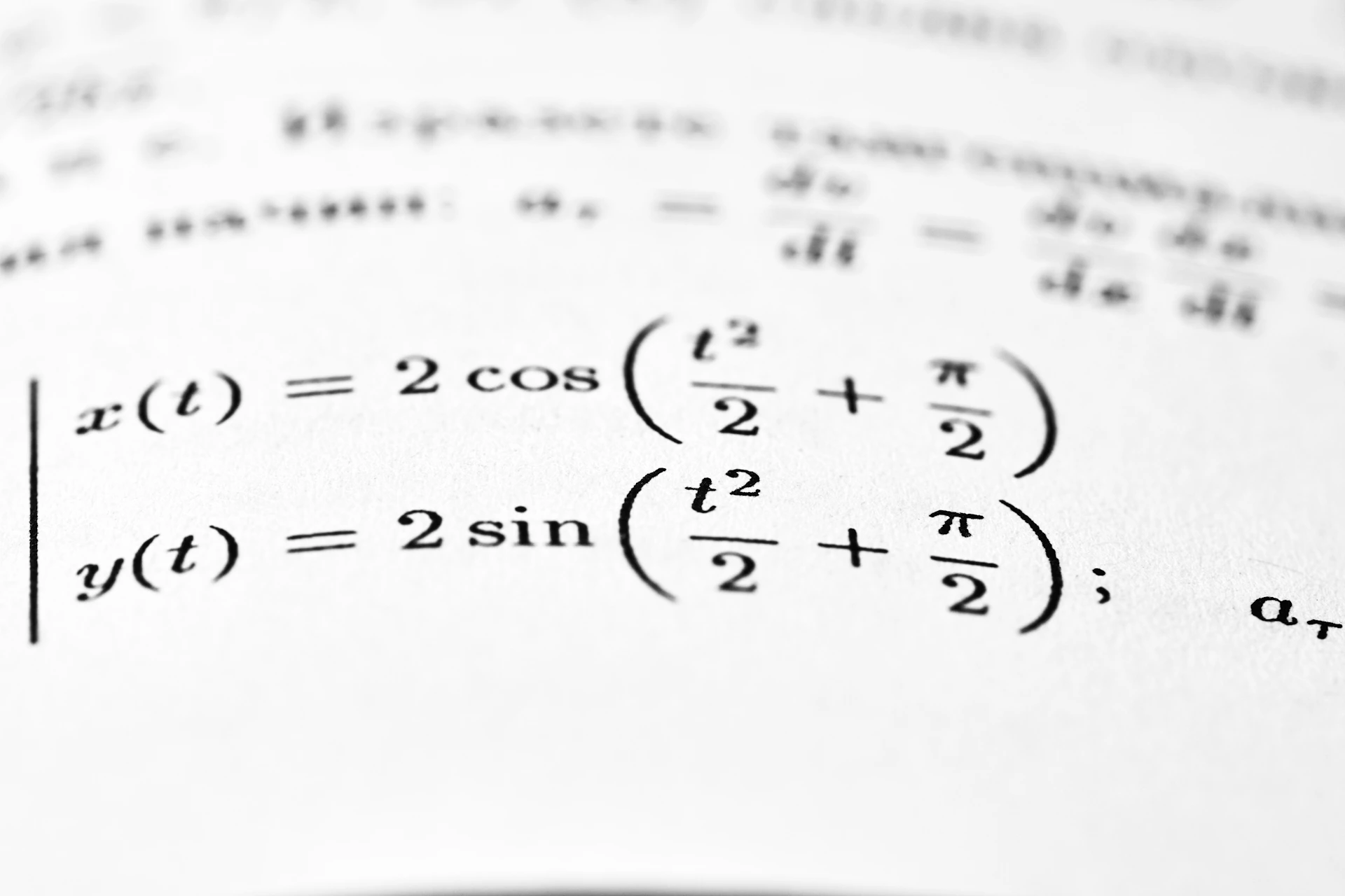 Mathematical equations are shown on a printed page.