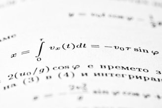 Mathematical formulas are written on a white page.