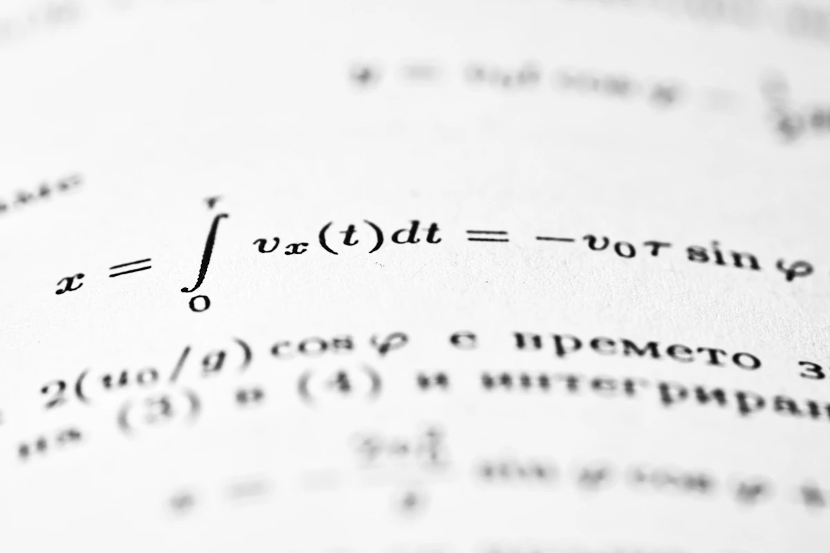 Physics numerical solution with force and acceleration equations written on paper