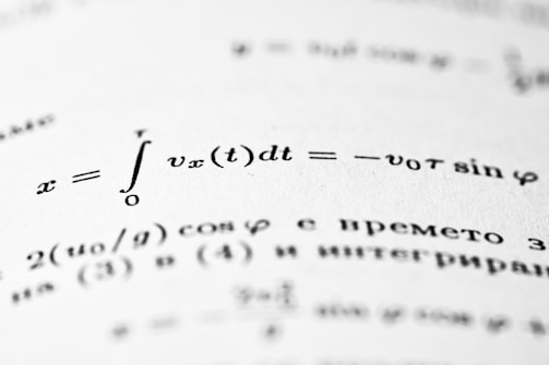 Mathematical equations are written on a page.