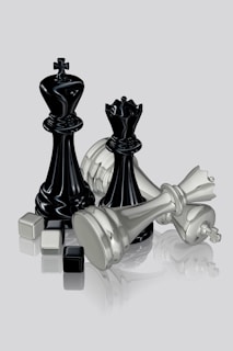 Chess pieces depicted in a dramatic and dynamic arrangement.