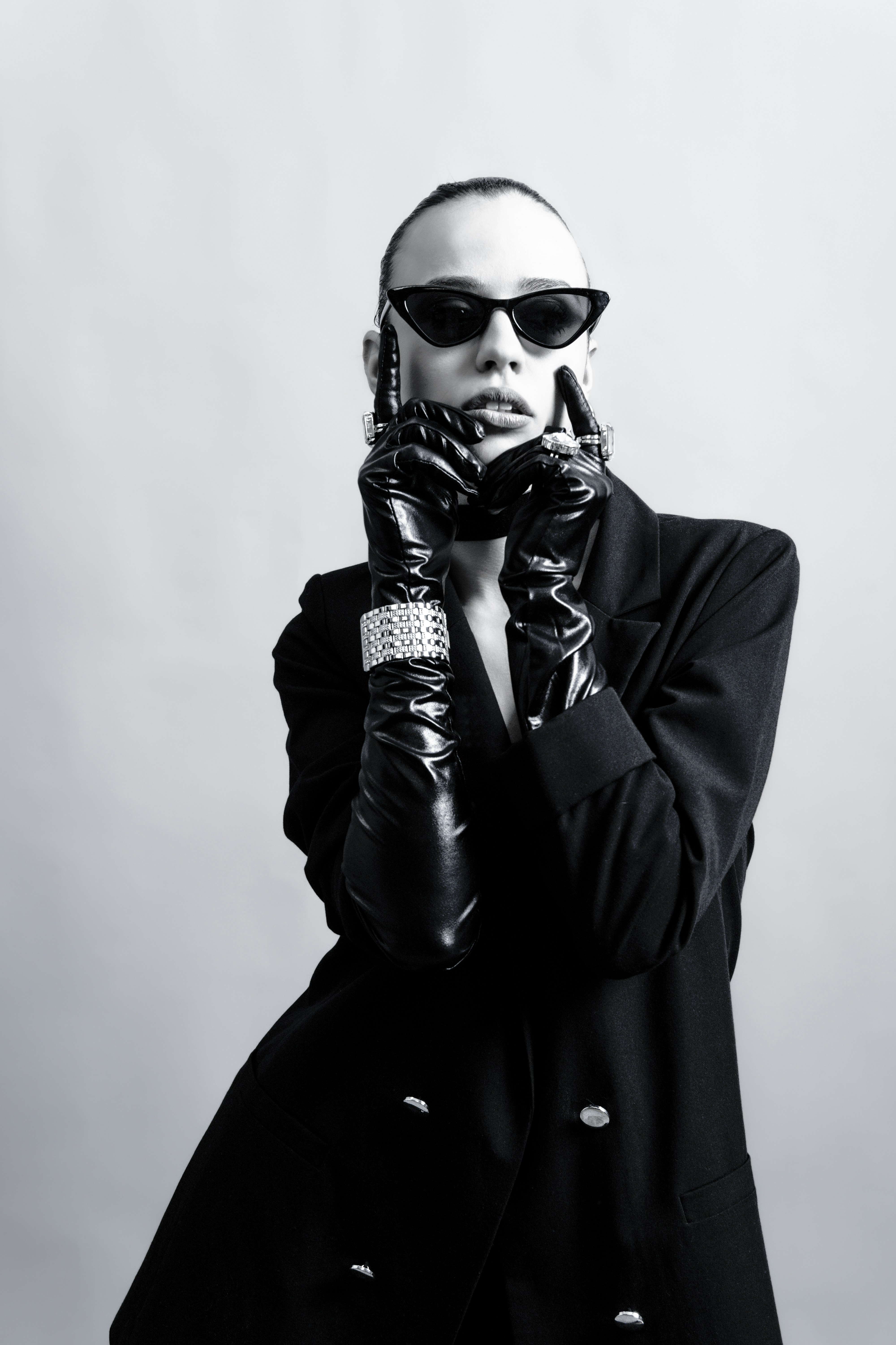 A fashionable person poses in black and white.