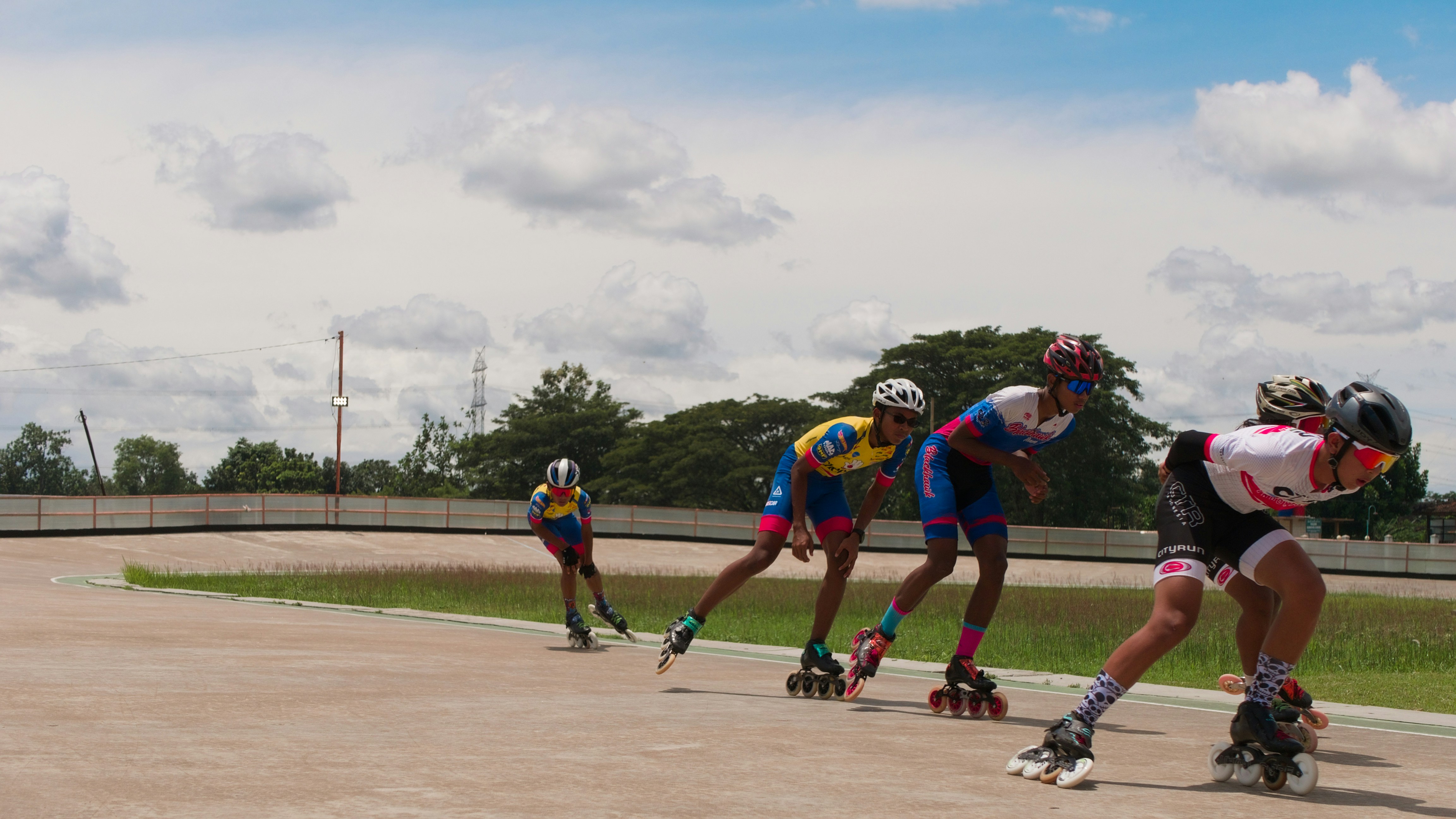 group of people racing on a roller blade track