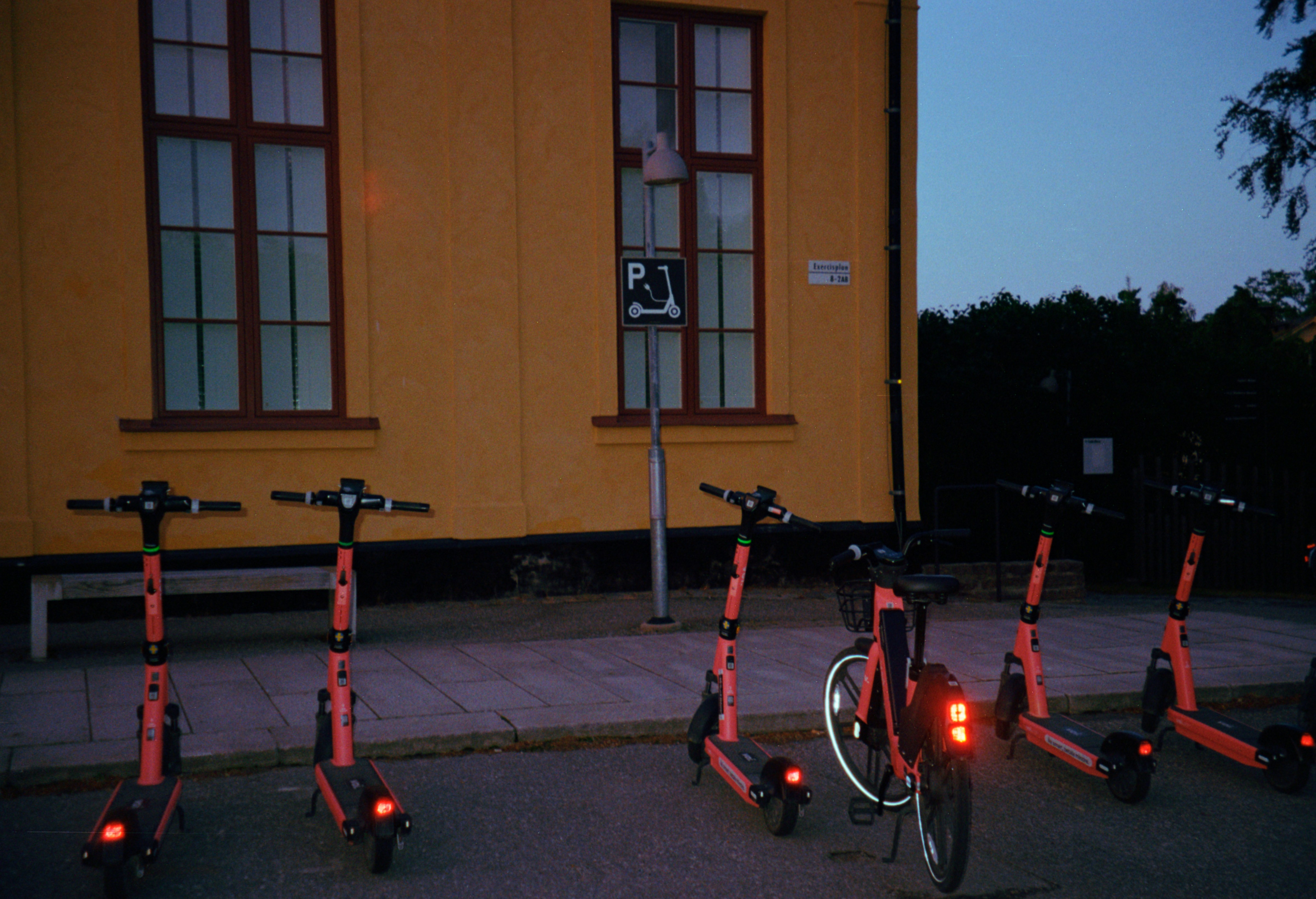 Electric scooters outside building
